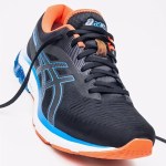 asics black and blue shoe with orange accents