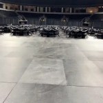 banquet set up with tables & chairs with pipe and drape backdrop