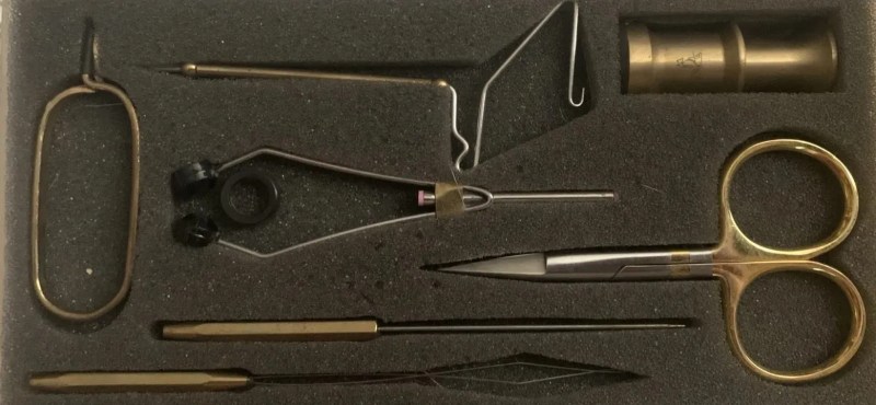 beginner fly tying tool kit a set of brass fly tying tools in a black foam case