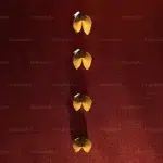 four fortune cookies arranged in a vertical line on a red surface decorative